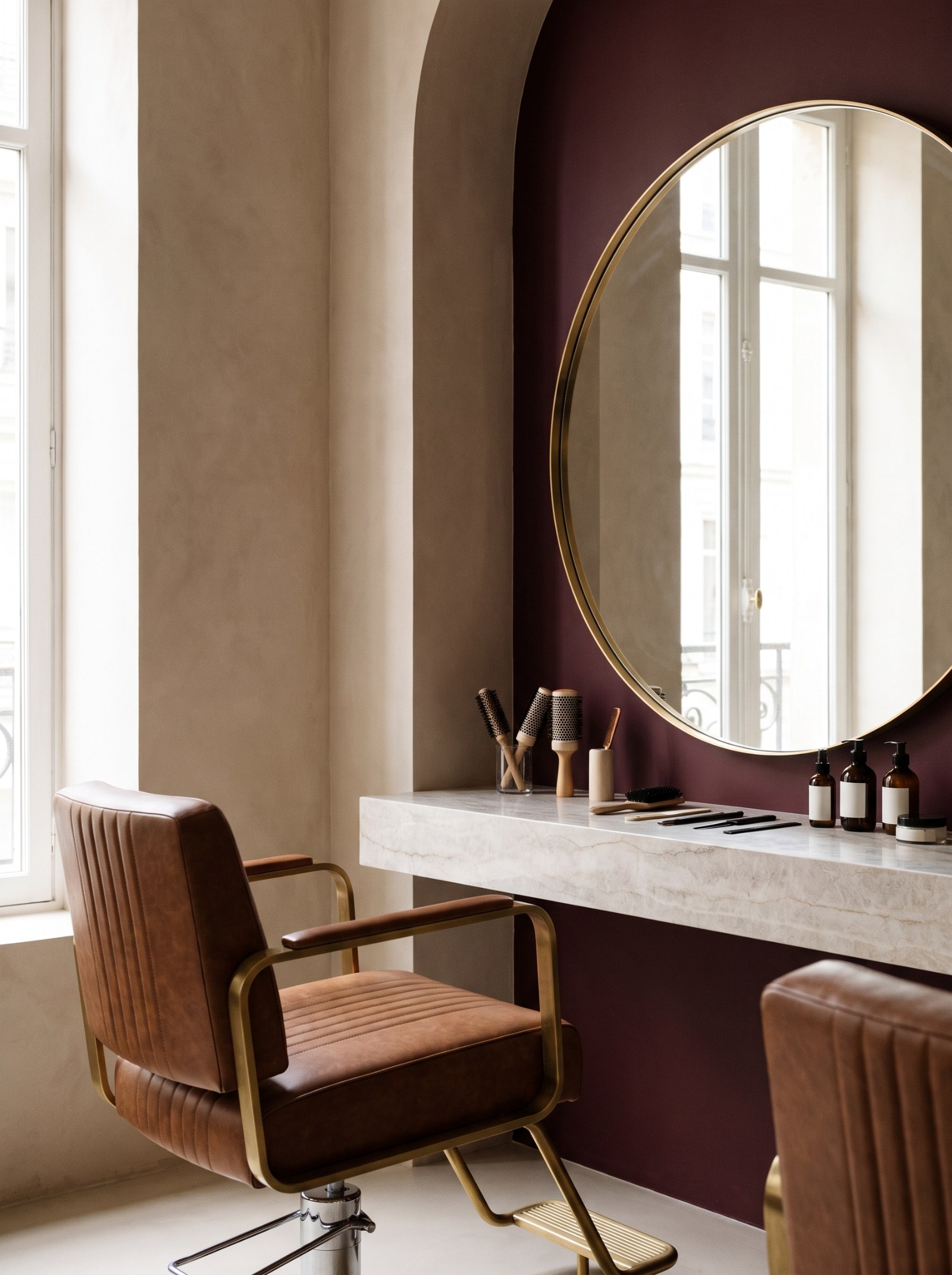 Salon styling station with a round mirror